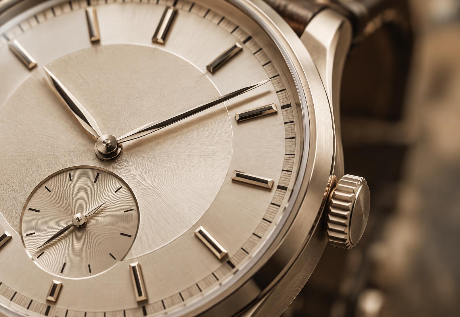 Macro view of a precision watch dial and crown